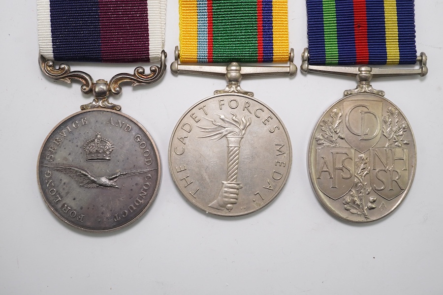 Three assorted service medals; GVI Cadet Forces medal to ACT. FG. Off. A. Liddell R.A.F.V.R (T); ERII Civil Defence Long Service medal unnamed; ERII RAFLSGC to E2418184 Cpl G R B Lowe RAF. Condition - fair to good.